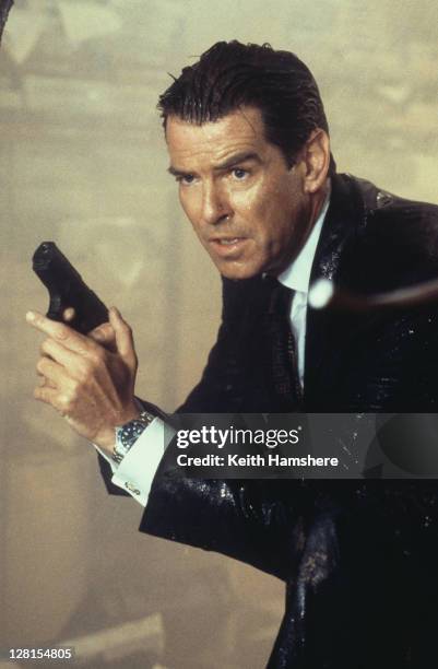 Irish actor Pierce Brosnan as 007, armed with his Walther P99, in a scene from the James Bond film 'The World Is Not Enough', 1999.