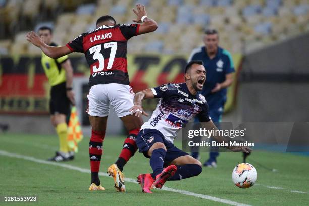 Lazaro of Flamengo fights for the ball with Marlon Pedrahita of Junior during a Group A match of Copa CONMEBOL Libertadores 2020 between Flamengo and...