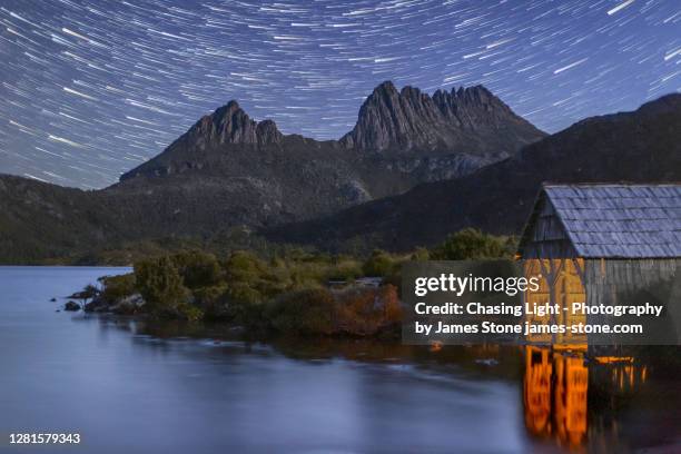 cradle mountain and dove lake boat shed by night - wilderness stock pictures, royalty-free photos & images