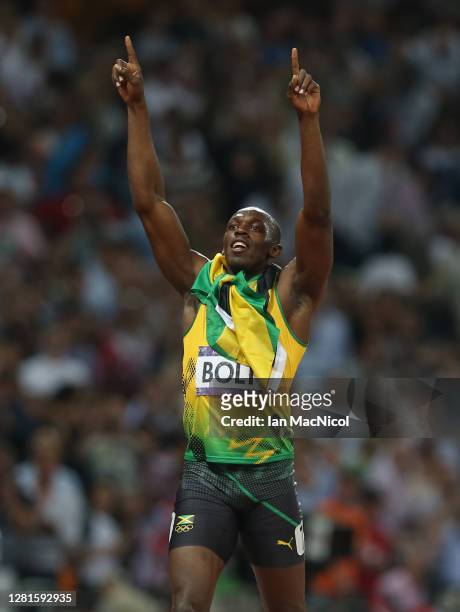 Usain Bolt of Jamaica celebrates after he wins gold during the Men's 200m Final on Day 13 of the London 2012 Olympic Games at Olympic Stadium on...