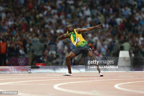Usain Bolt of Jamaica celebrates after he wins gold during the Men's 200m Final on Day 13 of the London 2012 Olympic Games at Olympic Stadium on...
