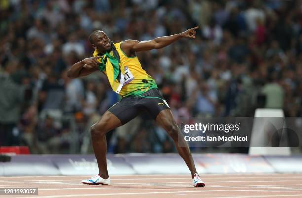 Usain Bolt of Jamaica celebrates after he wins gold during the Men's 200m Final on Day 13 of the London 2012 Olympic Games at Olympic Stadium on...