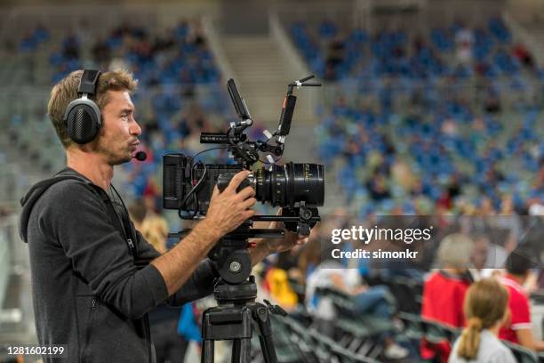 cameraman operating camera in court - cinematographer imagens e fotografias de stock