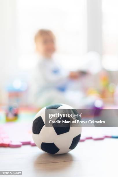 baby playing with his toys - baby football foto e immagini stock