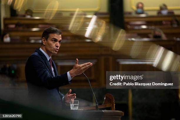 Spanish Prime Minister Pedro Sanchez speaks during a debate on a no-confidence motion at the Lower House of the Spanish Parliament on October 22,...