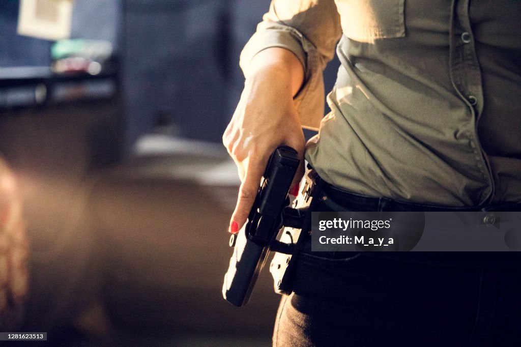 Hand holding a gun