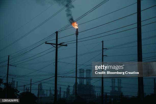 flare stack and oil refinery - lake charles louisiana stock pictures, royalty-free photos & images