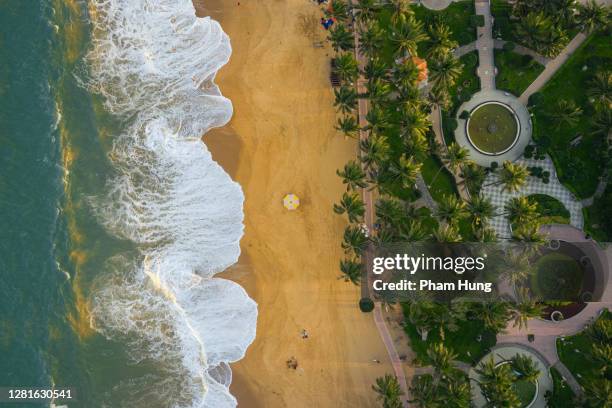 waves on nha trang beach - nha trang stock pictures, royalty-free photos & images