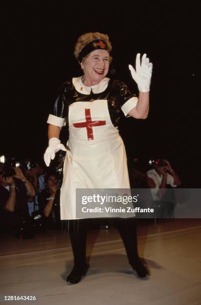 German-born American sex therapist Ruth Westheimer wearing a nurse uniform during Jean Paul Gaultier Fashion Show To Benefit AmFar, held at Shrine...