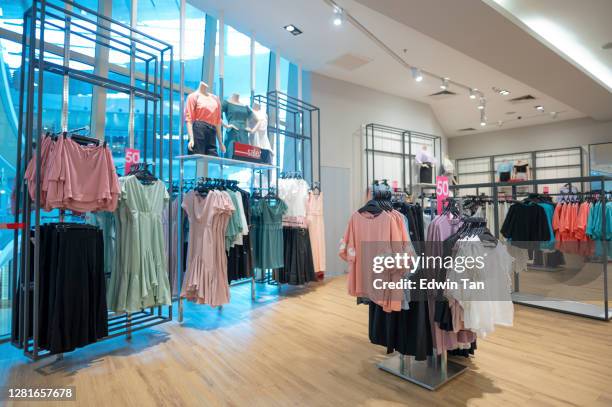 clothing store retail display in shopping mall - roupa de mulher imagens e fotografias de stock