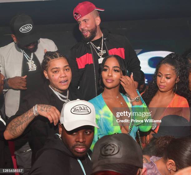 Young M.A., Ayisha Diaz, DJ Drama and Yasmine Lopez attend Chaos Tuesday Nights at Red Martini on October 20, 2020 in Atlanta, Georgia.