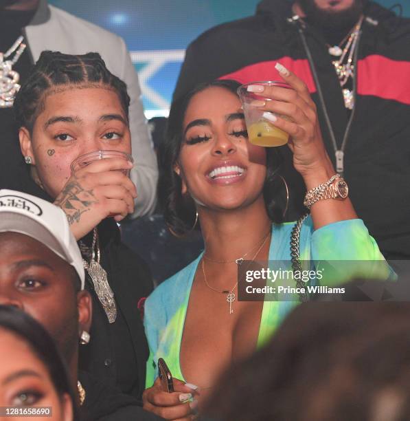 Young M.A. And Ayisha Diaz attend Chaos Tuesday Nights at Red Martini on October 20, 2020 in Atlanta, Georgia.