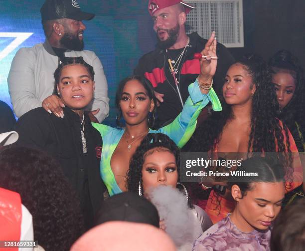 Young M.A and Ayisha Diaz attend Chaos Tuesday Nights at Red Martini on October 20, 2020 in Atlanta, Georgia.