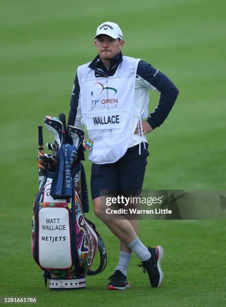 Matt Wallace of England's Bath and England rugby player caddie Ben Spencer is pictured on the 18th hole during Day One of the Italian Open at Chervo...