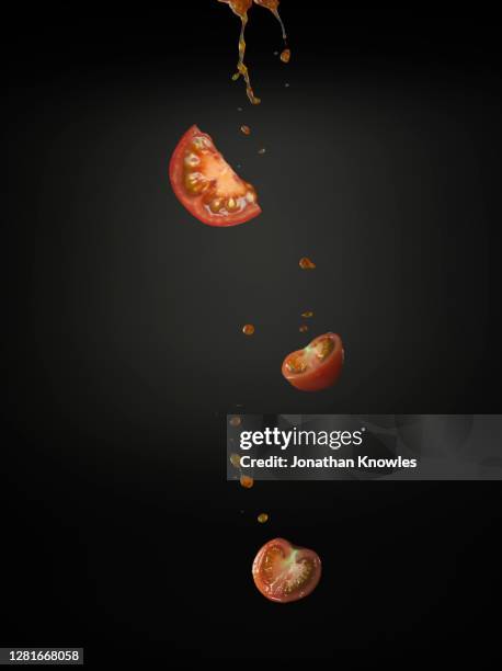 tomato slices falling - chopped tomatoes foto e immagini stock