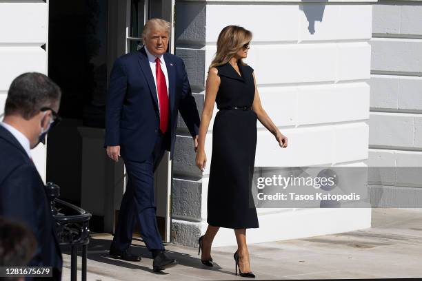 President Donald Trump and First Lady Melania Trump walk to the South Lawn to depart the White House on October 22, 2020 in Washington, DC. President...