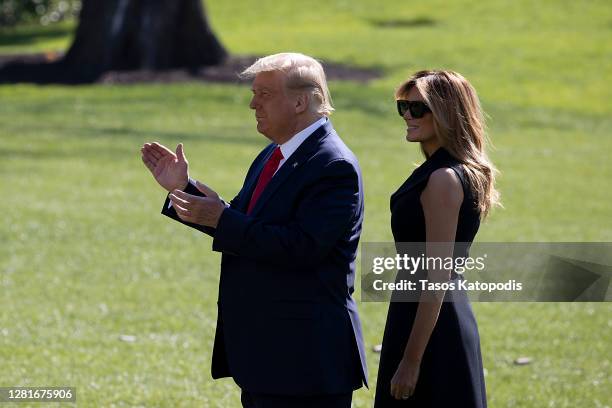 President Donald Trump and First Lady Melania Trump walk to the South Lawn to depart the White House on October 22, 2020 in Washington, DC. President...