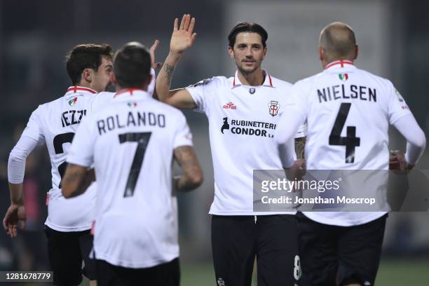Simone Emmanuello of Pro Vercelli celebrates with team mates after Gianmario Comi scored to give the side a 1-0 lead during the Serie C match between...