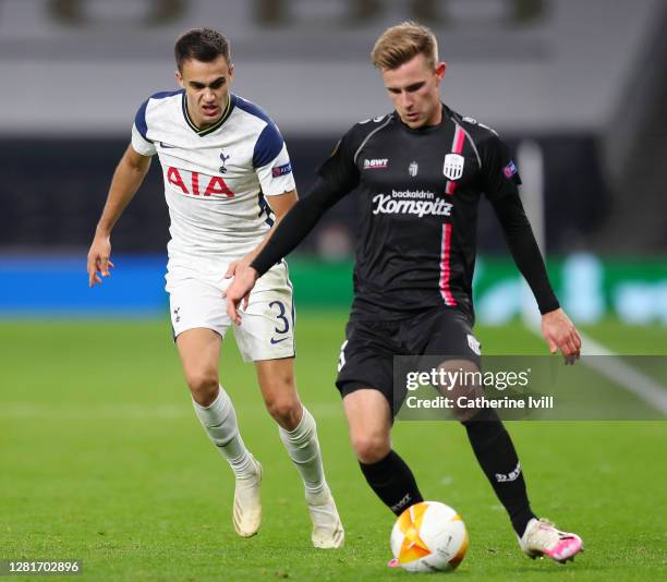 Johannes Eggestein of LASK is tackled by Sergio Reguilon of Tottenham Hotspur during the UEFA Europa League Group J stage match between Tottenham...