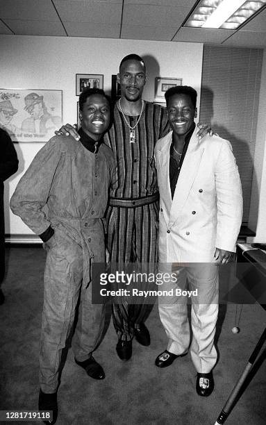 Singer Johnny Gill, Cleveland Cavaliers basketball player Ron Harper and 'Video Soul' host Donnie Simpson poses for photos during the opening of...