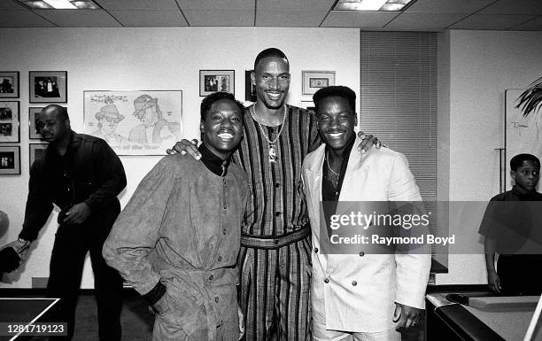 Singer Johnny Gill, Cleveland Cavaliers basketball player Ron Harper and 'Video Soul' host Donnie Simpson poses for photos during the opening of...