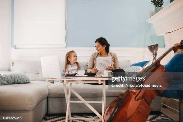 music teacher and student video lesson - girl cello stock pictures, royalty-free photos & images