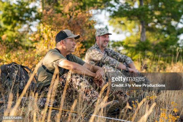 hunters rest while searching for elk - bow hunting stock pictures, royalty-free photos & images