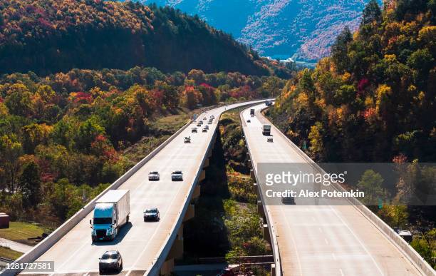 aerial view of the high bridge at the pennsylvania turnpike on a sunny day in fall with a busy traffic. - pennsylvania stock pictures, royalty-free photos & images