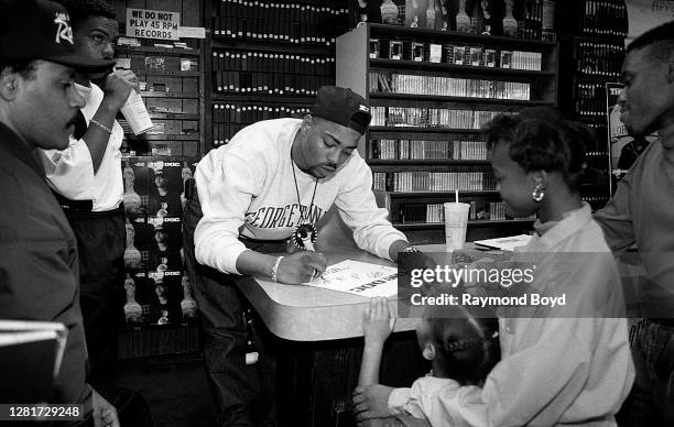 Rapper The D.O.C. Signs autographs and greets fans at Metro Music in Chicago, Illinois in October 1989.