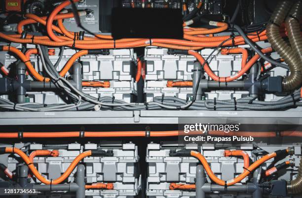 electric car lithium battery pack and power connections. blue toned - fahrzeug mit hybrid antrieb stock-fotos und bilder