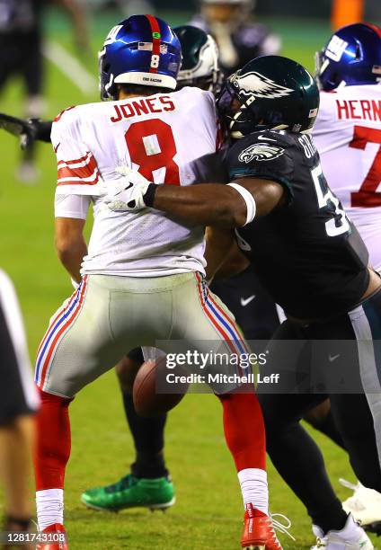 Brandon Graham of the Philadelphia Eagles forces a fumble on Daniel Jones of the New York Giants in the final seconds of the fourth quarter at...