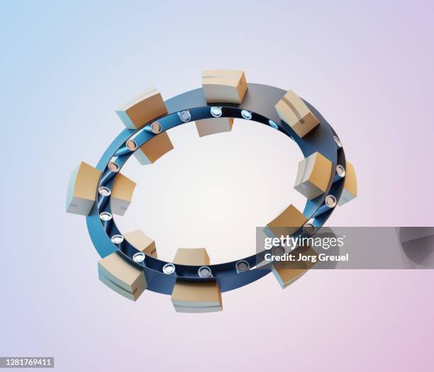 cardboard boxes on a moebius strip-shaped conveyor belt - circular economy stock pictures, royalty-free photos & images