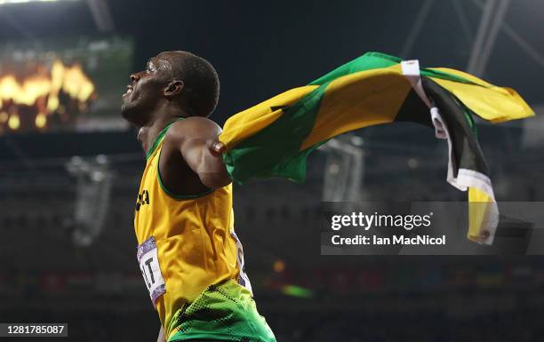 Usain Bolt of Jamaica celebrates after he wins gold during the Men's 200m Final on Day 13 of the London 2012 Olympic Games at Olympic Stadium on...