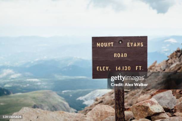 mount evans road sign - wood sign stock pictures, royalty-free photos & images