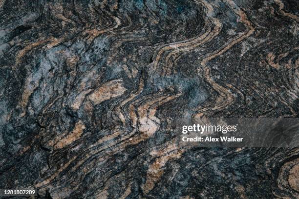 close up view of patterned stone in rocky mountains - ígnea fotografías e imágenes de stock