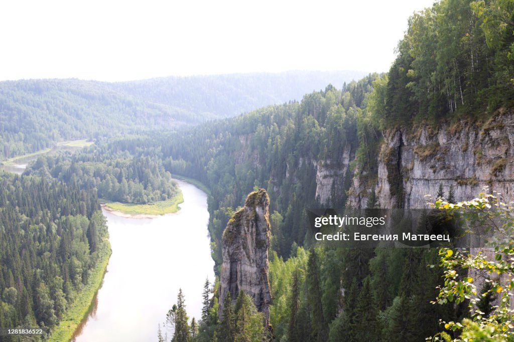 View of rock Devils finger of Usvinsky Pillars, Ural mountains and river Usva, Perm Krai, Russia
