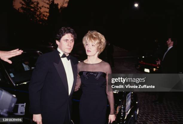 Actors Gabriel Byrne and Ellen Barkin arrive at the 49th Annual Golden Globe Awards at Beverly Hilton Hotel in Beverly Hills, California, United...