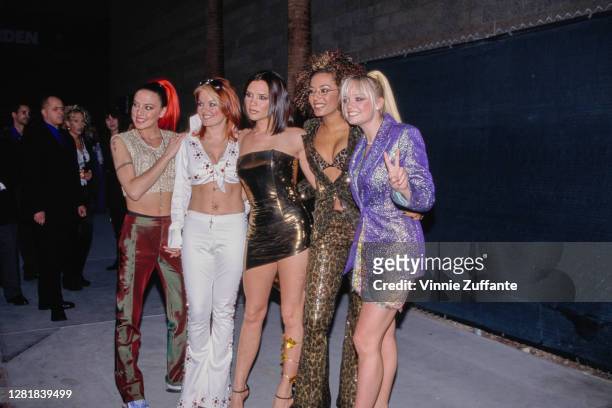 Pop group Spice Girls, "Sporty Spice" Melanie Chisholm, "Ginger Spice" Geri Halliwell, "Posh Spice" Victoria Adams, "Scary Spice" Melanie Brown and...