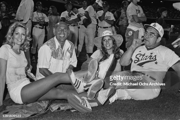 From left to right, actors Deidre Hall, Gavin MacLeod, Judy Norton and another man at a Los Angeles Dodgers versus celebrities baseball game, Los...