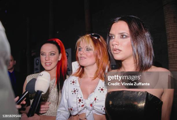 Pop group Spice Girls, "Sporty Spice" Melanie Chisholm, "Ginger Spice" Geri Halliwell, and "Posh Spice" Victoria Adams, interviewed during the Eighth...