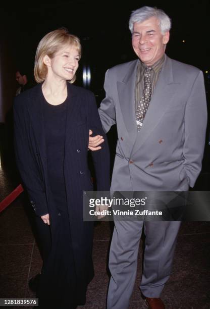 American actress and producer Ellen Barkin and American talent agent Ed Limato attend an event in circa 1995.