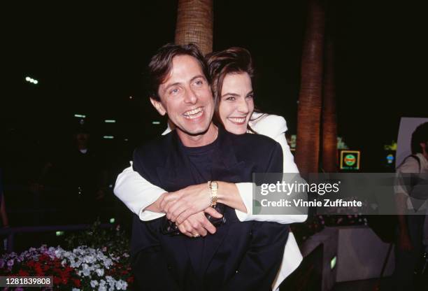 English playwright, novelist an author Clive Barker and actress Terry Farrell attend the premiere of "Hellraiser III - Hell On Earth" on September...