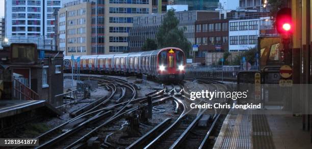passenger train curving through cityscape - harrow london stock pictures, royalty-free photos & images