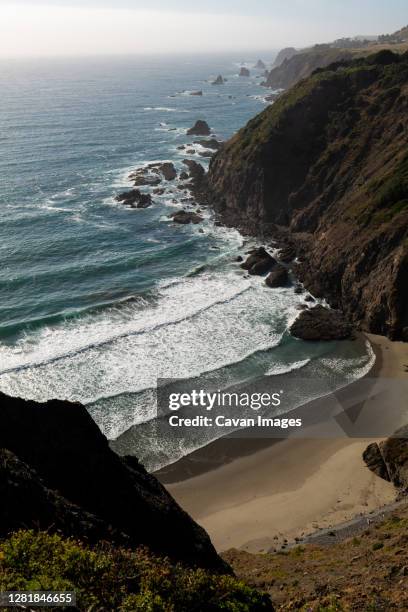 isolated cove with waves from ocean and golden sand in california - mendocino bildbanksfoton och bilder