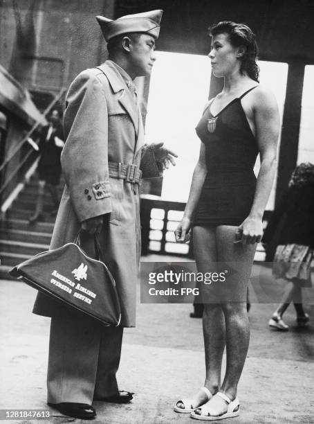 American high dive champion Sammy Lee with team-mate Juno Stover at the Empire Pool in Wembley during the 1948 Summer Olympics in London, UK, 6th...
