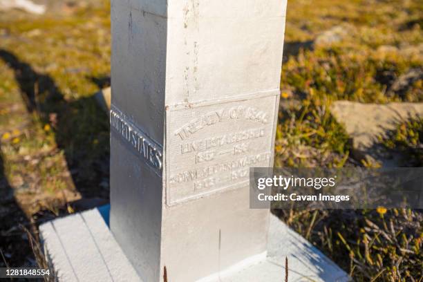 base of international border marker on mountain ridge. - list of diplomatic missions in washington d.c. stock pictures, royalty-free photos & images