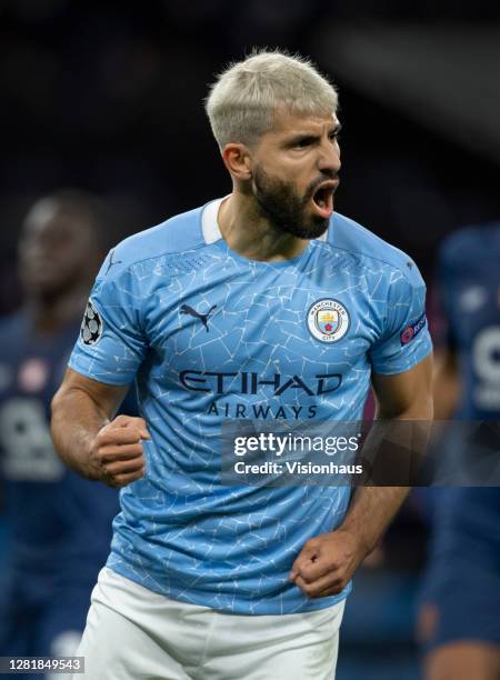 Sergio Aguero of Manchester City celebrates scoring the first goal from a penalty during the UEFA Champions League Group C stage match between...