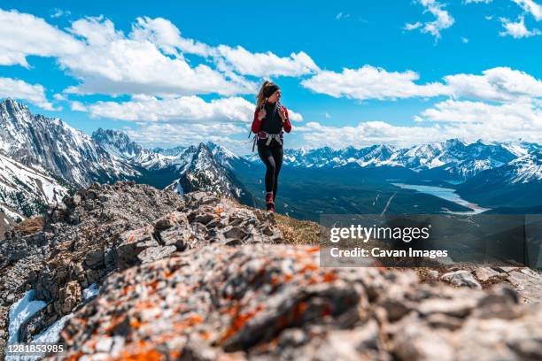 hiking above the canadian rockies surrounded by mountain peaks - kananaskis stock pictures, royalty-free photos & images