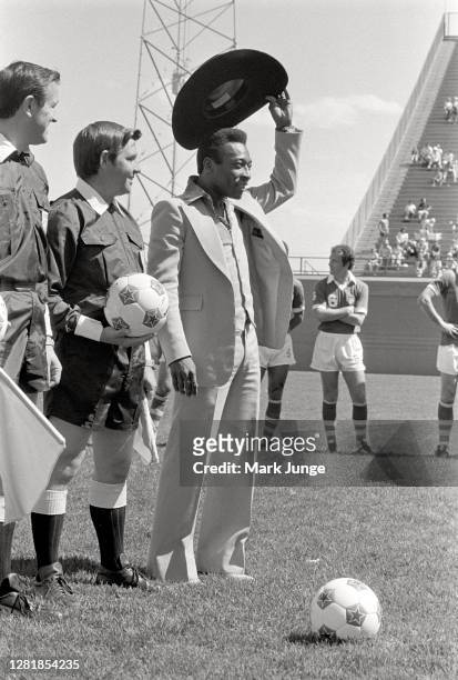 Former standout player Pele waves his cowboy hat at the fans while being being feted during a soccer game between the Colorado Caribous and the New...