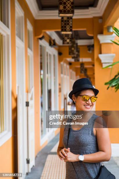 beautiful woman exploring china town in singapore - singapore alley stock pictures, royalty-free photos & images
